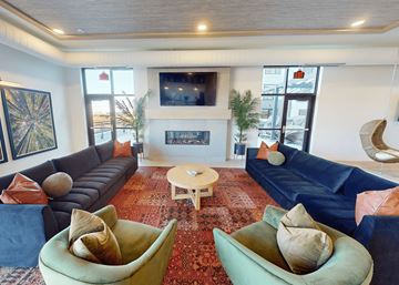 Hopkins apartment for rent - a living room with couches and chairs and a fireplace
