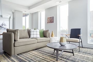 Minneapolis apartment for rent - a living room with a couch and a table