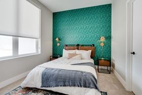 Roseville apartment for rent - a bedroom with green wallpaper
