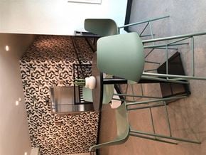 St. Paul apartment for rent - a dining room table with a green chair and a leopard print
