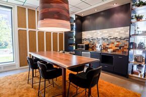 Richfield apartment for rent - A modern kitchen with a dining table and chairs.