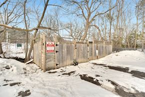 Aurora apartment for rent - a wooden fence with a no trespassing sign on it
