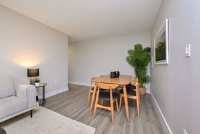 Orangeville apartment for rent - a dining room with a wooden table and chairs