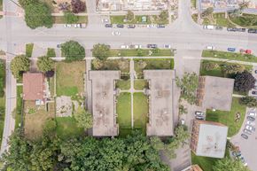 Toronto apartment for rent - arial view of a campus with cars parked on the side of the road