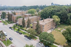 Toronto apartment for rent - a view from the top of a building of a large brick building with a long chimney
