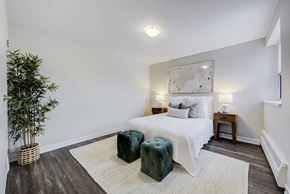 Richmond Hill apartment for rent - a bedroom with a bed and two end tables