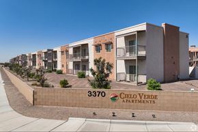 Yuma apartment for rent - A row of apartment buildings with the number 3370 and the name Cielo Verde Apartments on a wall.