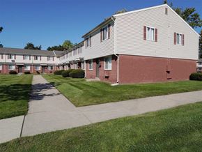Taylor apartment for rent - an apartment building with a sidewalk in front of it
