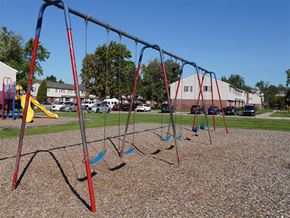 Taylor apartment for rent - a swing set on a playground in a park