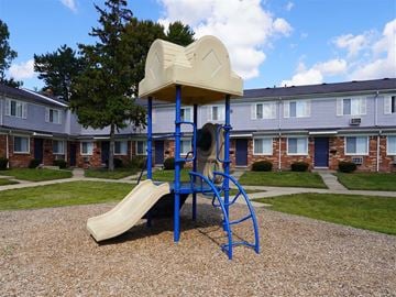 Taylor apartment for rent - a playground with a swing set and a slide