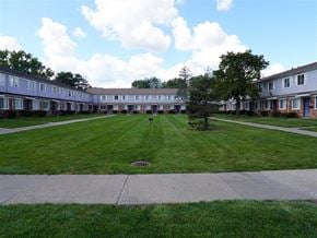 Taylor apartment for rent - an empty lawn in front of an apartment building