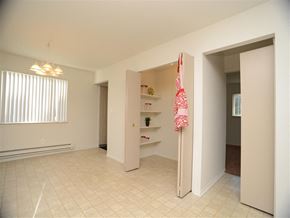 Taylor apartment for rent - A room with a white tile floor and a pink towel hanging on a pole.