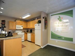 Taylor apartment for rent - A kitchen with a sign that says The Courtyards and The Springs.