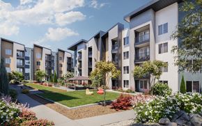 Reno townhouse for rent - A row of modern apartment buildings with a landscaped garden in the foreground at The Village at Hawk View, Reno.