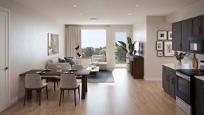 Reno townhouse for rent - A modern kitchen and dining area with a view of the outdoors at The Village at Hawk View, Reno, Nevada.