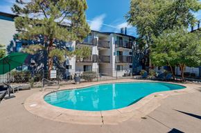 Aurora apartment for rent - a swimming pool with an apartment building in the background