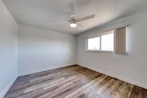 San Leandro apartment for rent - a bedroom with hardwood floors and a ceiling fan
