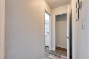 San Leandro apartment for rent - a bedroom with a medium sized window and a door that leads to a bathroom