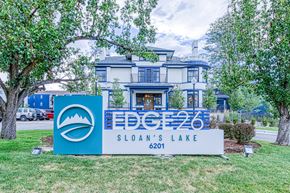 Edgewater apartment for rent - a sign in front of a house with a lawn and trees