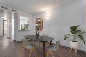 Northglenn apartment for rent - A dining room with a round table and chairs.