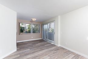 Culver City apartment for rent - a bedroom with hardwood floors and white walls