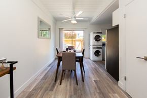 Fremont apartment for rent - a dining area with a table and chairs and a washer and dryer