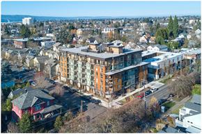 Portland apartment for rent - an aerial view of a large brick building with a grey roof