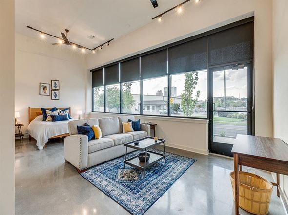 Knoxville apartment for rent - a living room with a bed and a couch in front of a window