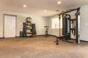 Smyrna apartment for rent - A spacious home gym with a variety of exercise equipment.