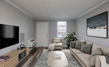 Madison apartment for rent - A living room with a couch, a coffee table, a television, and a painting on the wall.