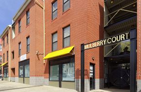 Baltimore apartment for rent - a brick building with a yellow awning and the words murphy court