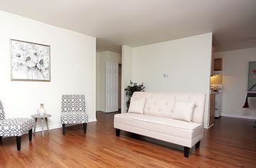 Baltimore apartment for rent - a living room with a couch and two chairs