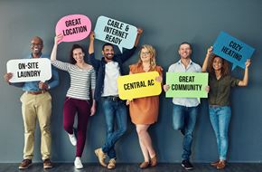 Baltimore apartment for rent - a group of people holding signs that say great community