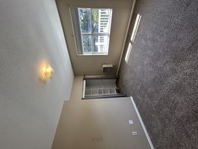 Groton apartment for rent - A small window with a view of trees is on the wall.