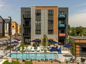 Richfield apartment for rent - a large building with a pool in front of it