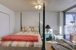 Boulder apartment for rent - a bedroom with a bed and a large window