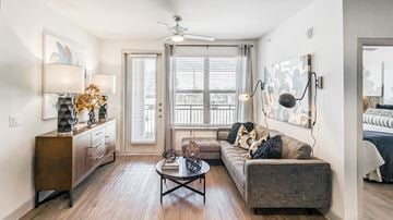 Georgetown apartment for rent - A living room with a couch, a coffee table, and a side table with a lamp.