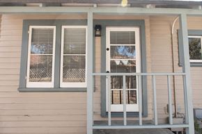 Ventura apartment for rent - A house with a white door and two windows with white shutters.
