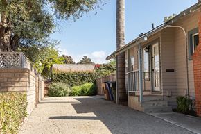 Ventura apartment for rent - A house with a driveway and a tree in front.