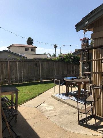 Ventura apartment for rent - A backyard with a pool table and a fence.