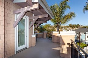 Ventura apartment for rent - A balcony with a white door and a railing.