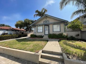 Ventura apartment for rent - A house with a front yard and a concrete pathway leading to the front door.