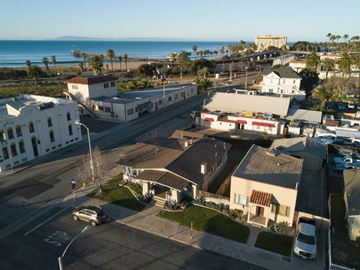 Ventura apartment for rent - A coastal town with a view of the ocean and a large white building in the distance.