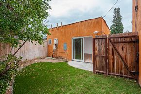 Los Angeles apartment for rent - A backyard with a brown fence and a green lawn.