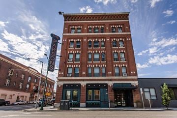 Spokane apartment for rent - The Parson's building is a red brick structure with a black awning.