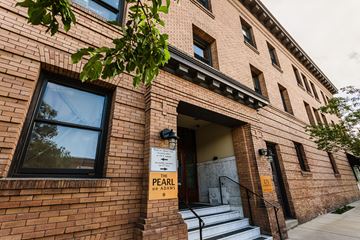 Spokane apartment for rent - A brick building with a sign that says "The Pearl on Adams".