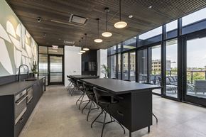 Chicago apartment for rent - a large dining room with a long black table and chairs