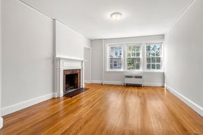 Cambridge apartment for rent - A room with a fireplace and a window.