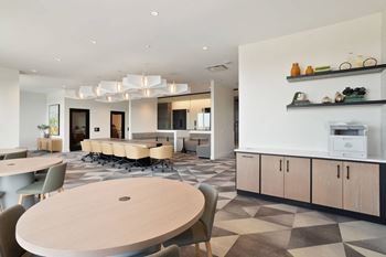 A communal area with tables and chairs