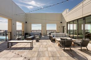 Chicago apartment for rent - Rooftop terrace with couches tables and chairs and a pool in the background at Platform 4611, Illinois
